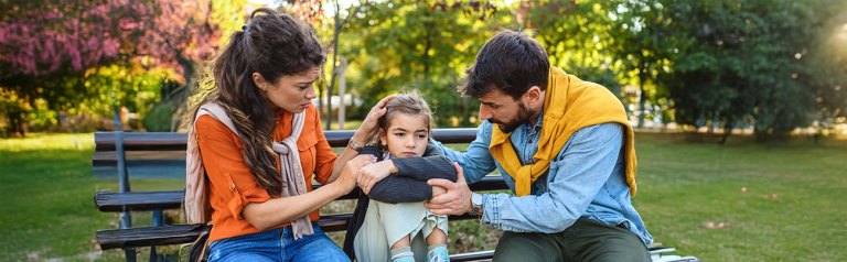 Parents comforting their child when the world feels unsafe